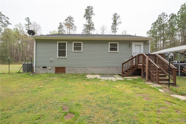 Rear view of property with crawl space and a lawn | Image 38