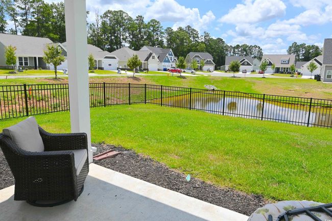 View of yard with a residential view and a water view | Image 30