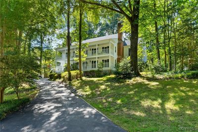 View of front of home with a balcony and a front yard | Image 3