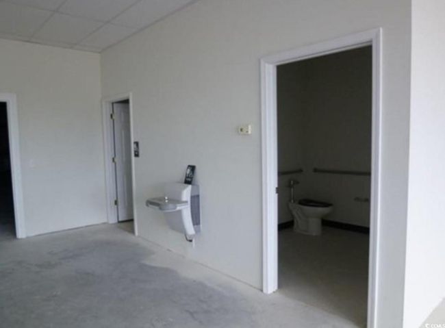 Bathroom with a drop ceiling and toilet | Image 7