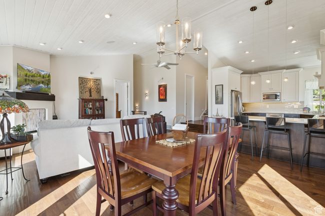 Dining room featuring dark wood-type flooring, recessed lighting, a chandelier, lofted ceiling, and wooden ceiling | Image 10