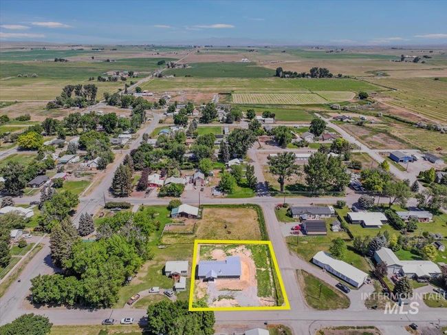 Aerial view of sparsely populated area featuring rows of crops and property boundaries highlighted | Image 44