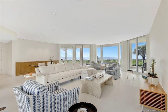 Oversized living/dining room with direct views of the ocean. | Image 6
