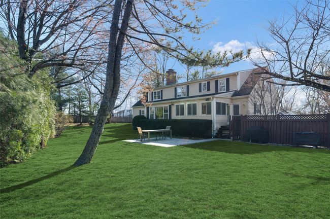 Back of house featuring large level backyard and patio | Image 28
