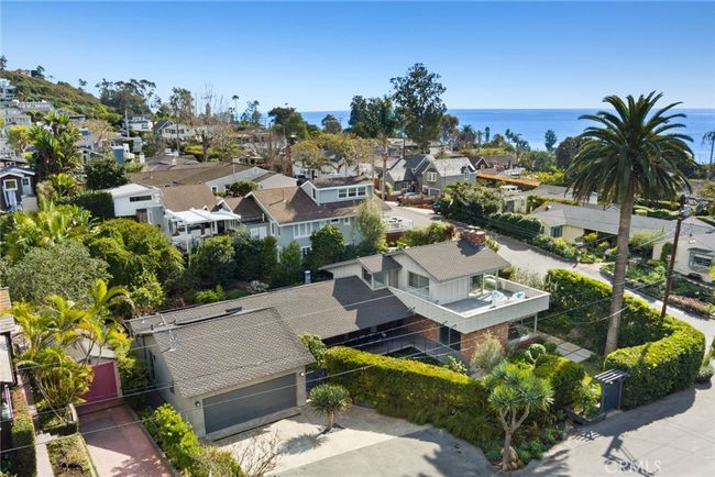 Sumptuous landscaping embellishes special times with friends and loved ones, and a driveway allows for ample guest parking beyond the home’s two-car garage. | Image 27