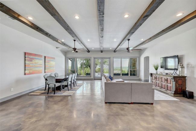 Polished concrete floors are known to be extremely energy efficient and improve natural light making a home more beautiful and keeping costs low. Notice the combined living and dining space which keeps the whole family united! | Image 8