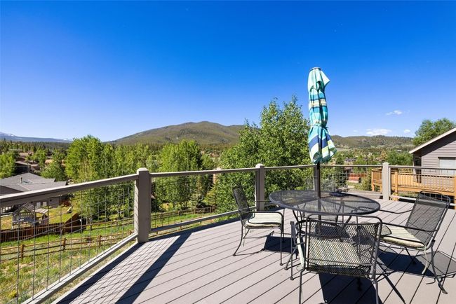 Deck with a mountain view and outdoor dining​​‌​​​​‌​​‌‌​‌‌​​​‌‌​​‌‌​‌​​​​​‌ area | Image 16