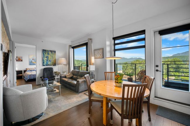 Dining area with a mountain view and wood finished floors | Image 9