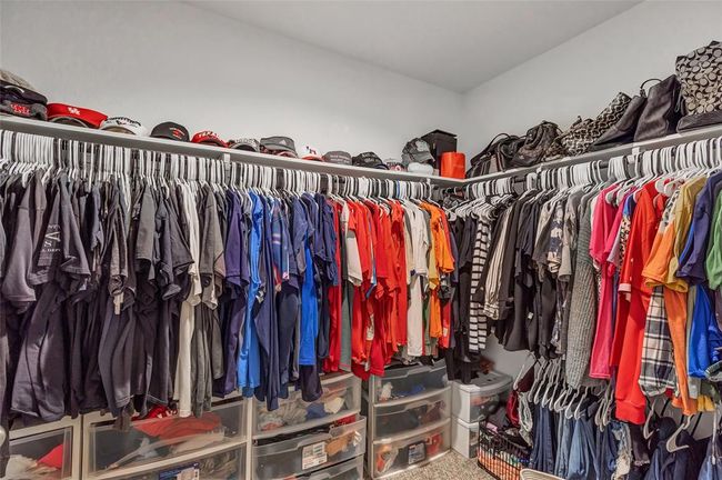 Large walk in closet with access from primary bathroom | Image 33