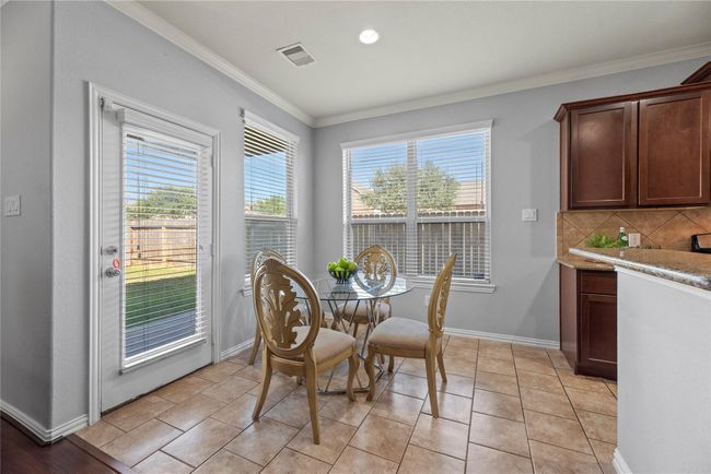 Fashioned with an incredibly tidy breakfast nook, there is plenty of room for traditional morning fare of pancakes, fresh fruit, and hot coffee. Laugh with your loved ones, as you enjoy eating a plate of homemade goodness! | Image 7
