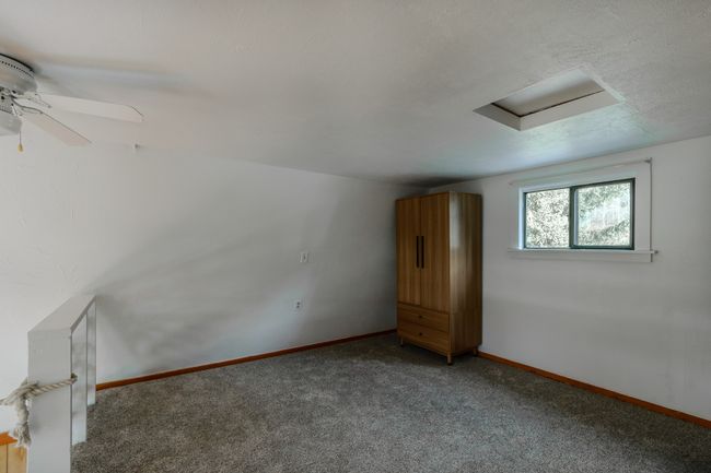 Bonus room featuring ceiling fan and carpet floors | Image 52
