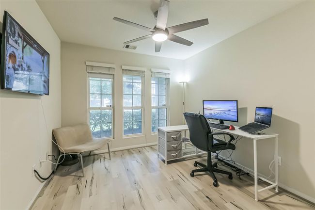 Optional 3rd bedroom/study with natural light and modern ceiling fan. | Image 28