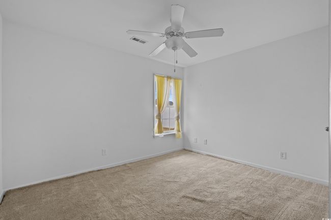 Carpeted spare room with baseboards and ceiling fan | Image 33