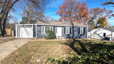 Single story home with a garage and a front yard | Image 2