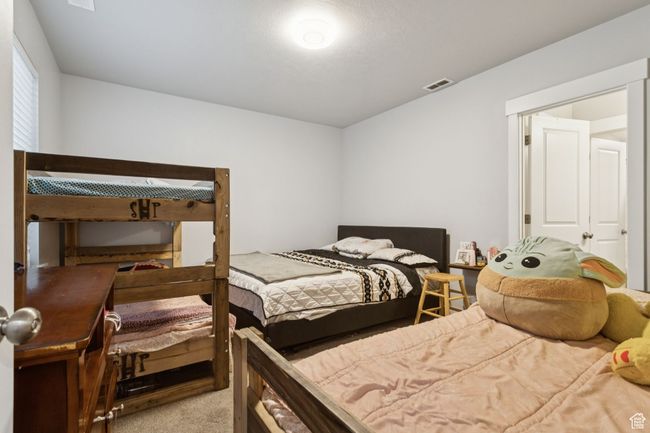 Bedroom with carpet floors | Image 35