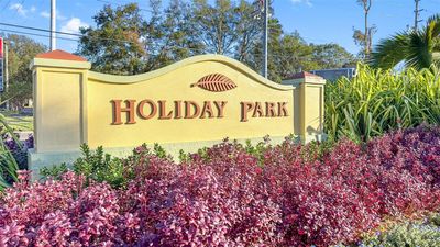 Live in the sought-after Holiday Park neighborhood, known for its golf cart parades, food truck nights, and family-friendly events. | Image 2