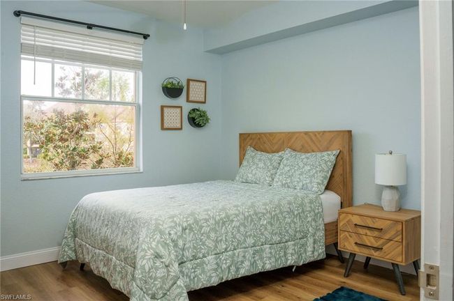 Bedroom featuring baseboards and wood finished floors | Image 20