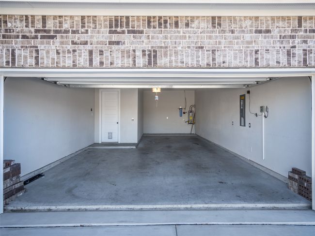 Garage with a garage door opener | Image 5
