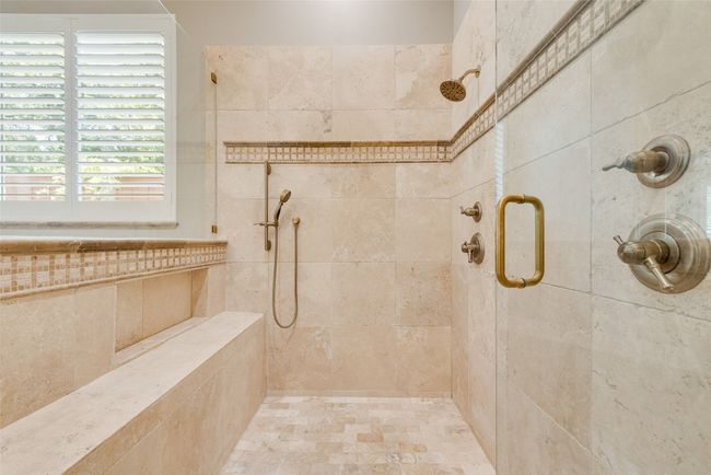 Bathroom featuring a tile shower | Image 26