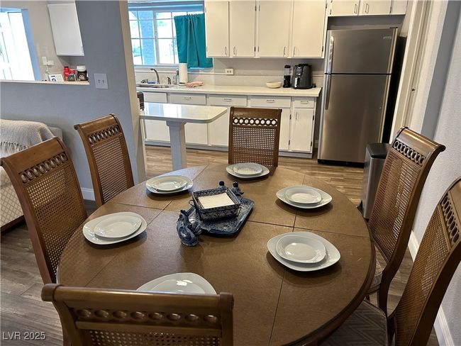Dining area with wood finished floors | Image 10