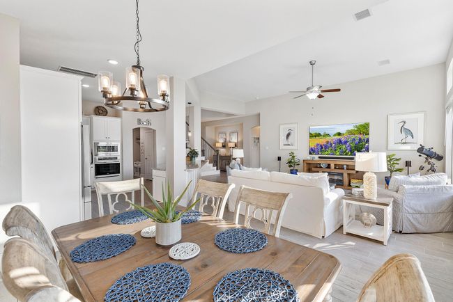 Experience the inviting warmth of this open floor plan, where neutral tones and a bright, welcoming atmosphere create the perfect backdrop for everyday living and entertaining. | Image 16