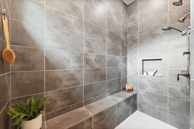 Oversized shower with dual shower heads and bench | Image 30