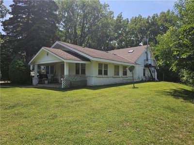 View of property exterior featuring a lawn | Image 1