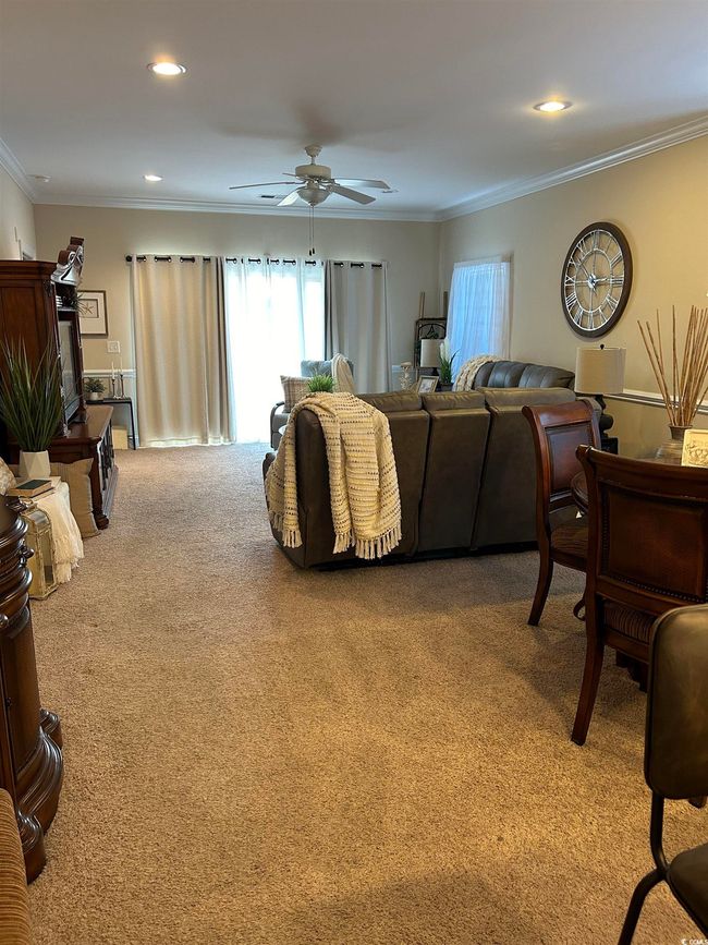 Living room featuring carpet floors, recessed lighting, crown molding, and a ceiling fan | Image 6