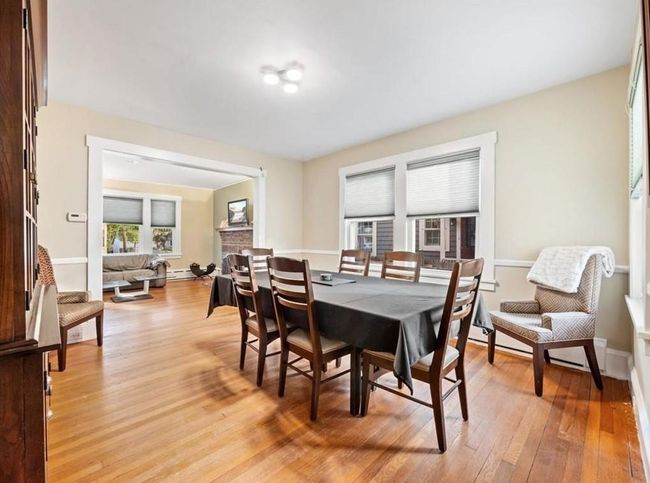 Dining room featuring baseboards, baseboard heating, and light wood-style flooring | Image 4