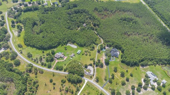 11933 Pasco Trails Blvd, House other with 4 bedrooms, 3 bathrooms and null parking in SPRING HILL FL | Image 49