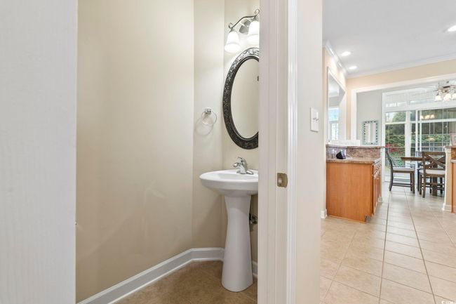 Half bathroom with ornamental molding, recessed lighting, tile patterned floors, and baseboards | Image 12