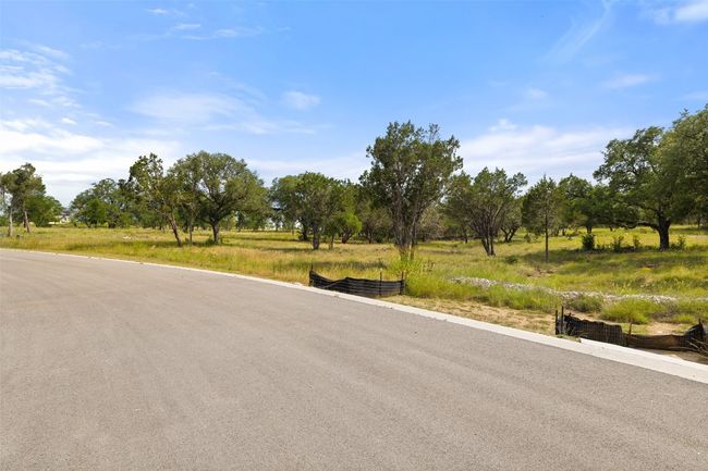 View of asphalt road featuring a view of rural / pastoral area | Image 35
