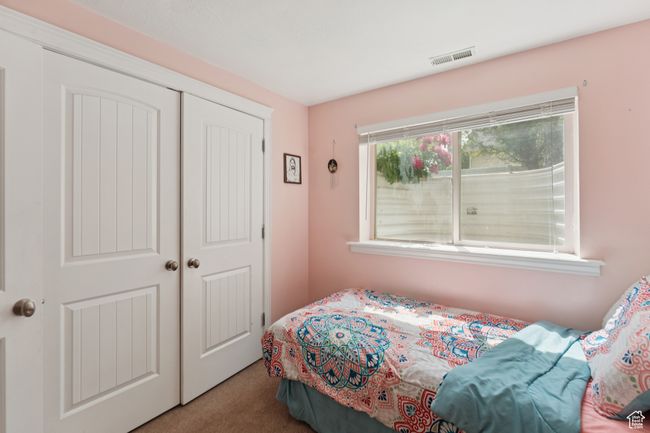 Bedroom with carpet floors and a closet | Image 21