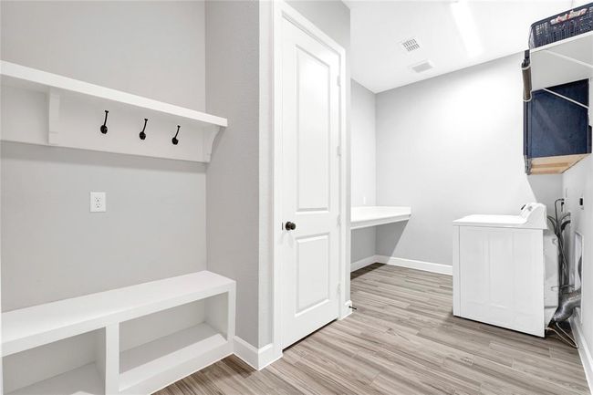 Custom folding table and wood cabinets for extra storage | Image 35