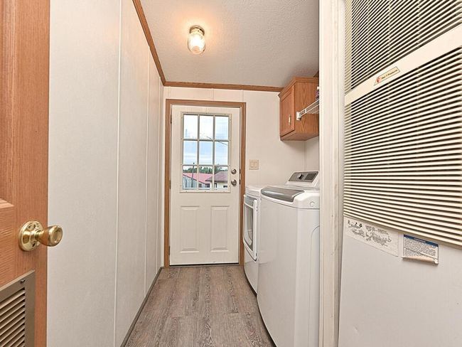 Laundry, utilities and rear entry way | Image 15