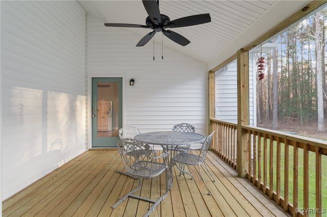 Sunroom with ceiling fan and vaulted ceiling | Image 43