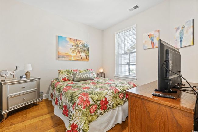 Bedroom featuring wood finished floors | Image 22