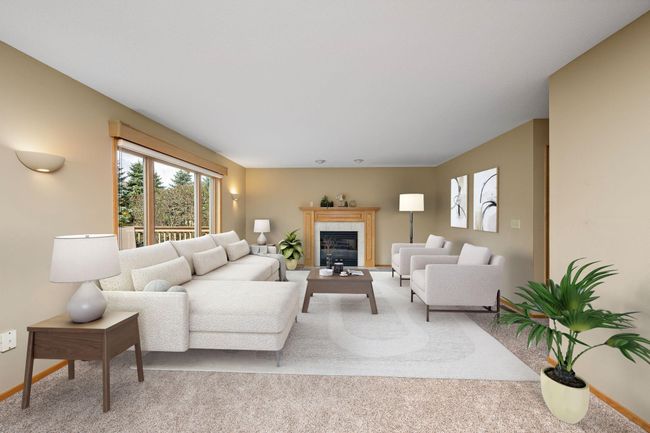 Main level family room with fireplace. | Image 12