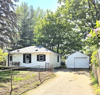 Featuring an oversized 1 car garage and large driveway for ample parking. | Image 3