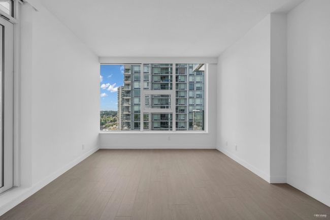 Unfurnished room featuring wood finished floors and baseboards | Image 8