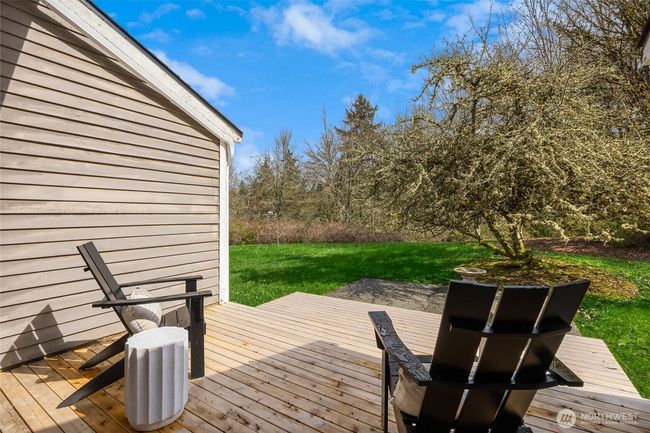 One of the 3 decks of this home that allows easy access to the natural grounds. | Image 10