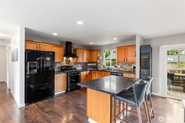 Spacious kitchen with gas stove. | Image 8