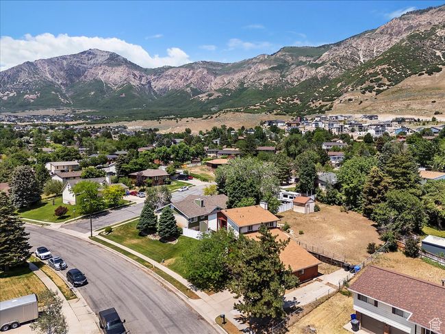 Aerial perspective of suburban area featuring a mountain backdrop | Image 29