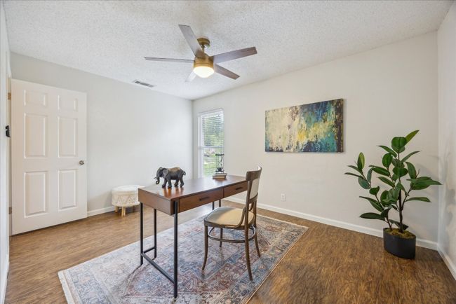Office featuring wood finished floors, a textured ceiling, and a ceiling fan | Image 20