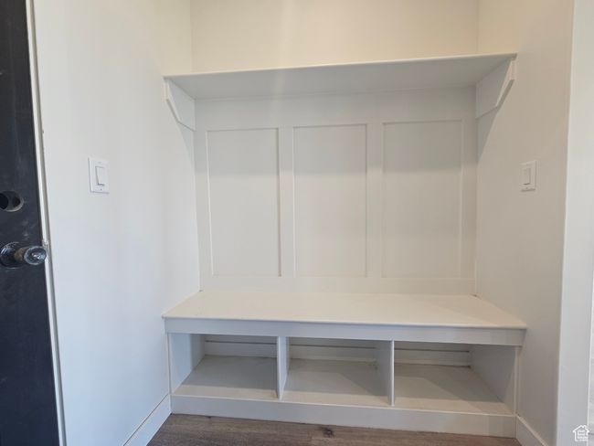 Mudroom with baseboards and wood finished floors | Image 11
