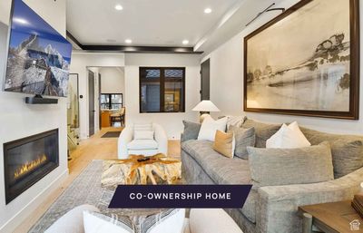 Living room featuring light hardwood / wood-style flooring | Image 1