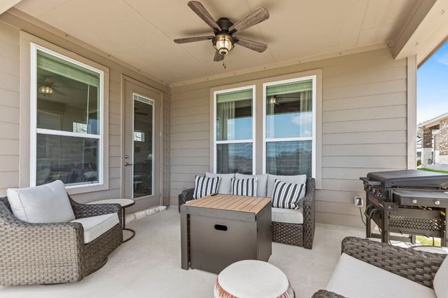 View of patio with ceiling fan and an outdoor living space | Image 30