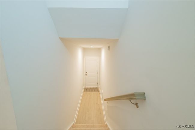 Stairway with baseboards and wood finished floors | Image 4
