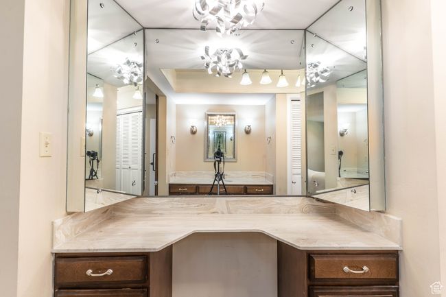 Bathroom with a raised ceiling and vanity | Image 18