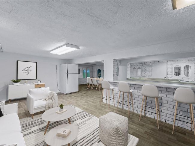 Living area featuring a textured ceiling and wood finished floors | Image 28